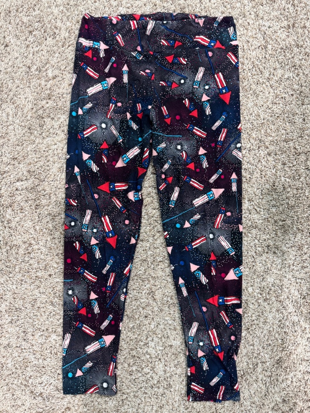 LuLaRoe multi-colored fireworks leggings on black background TC fits 12-22